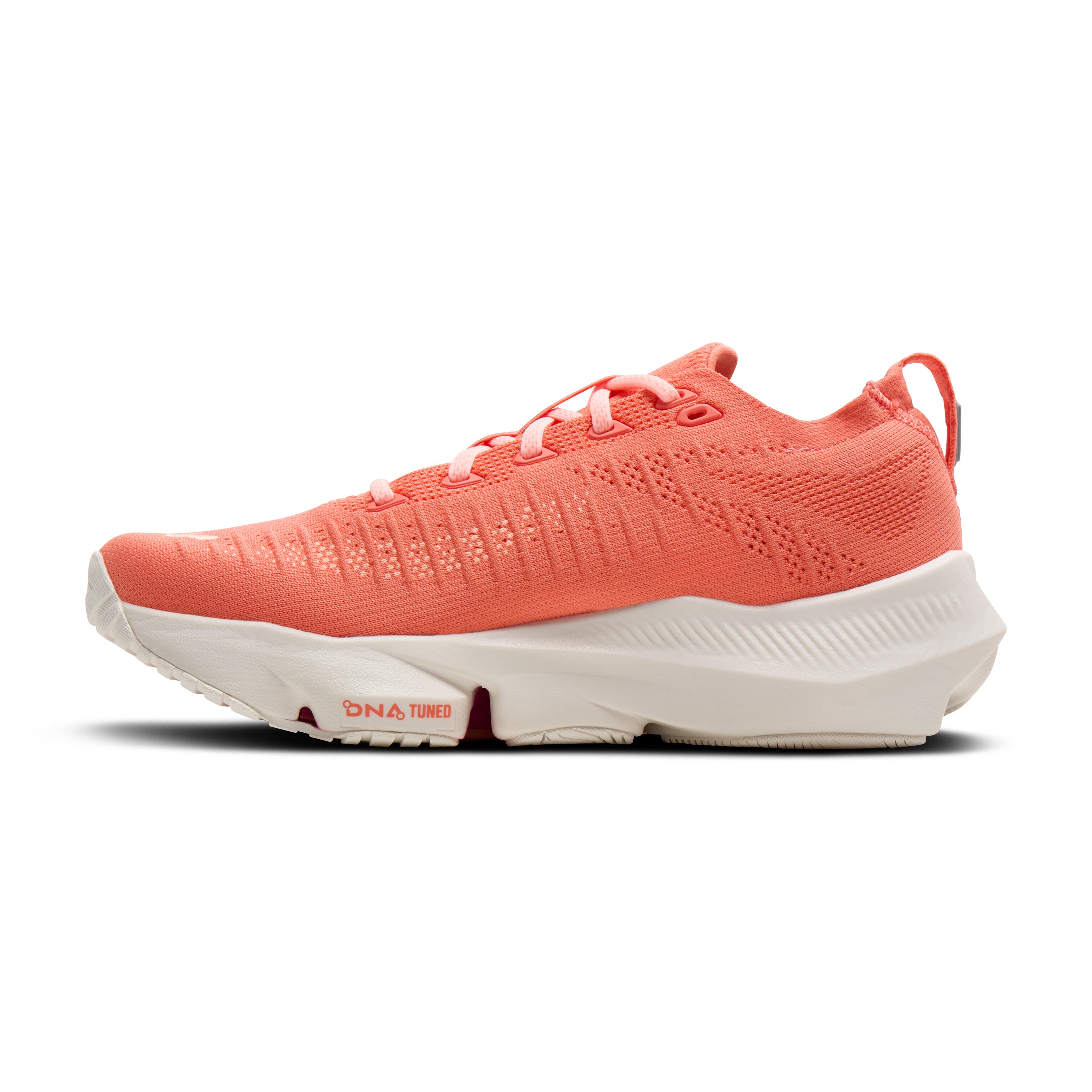 Coral running shoe with white sole on a white background