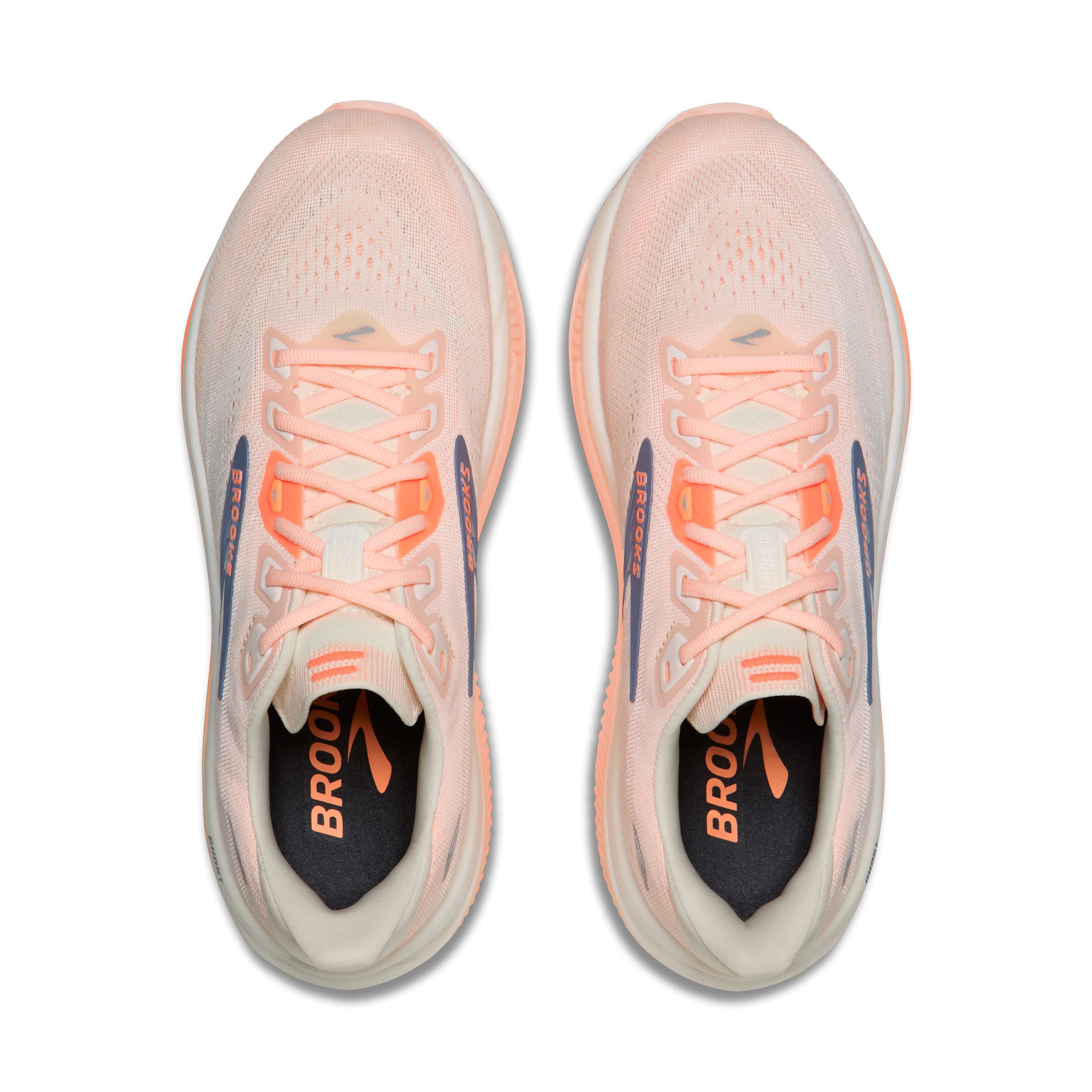 Pair of pink running shoes with orange accents on a white background