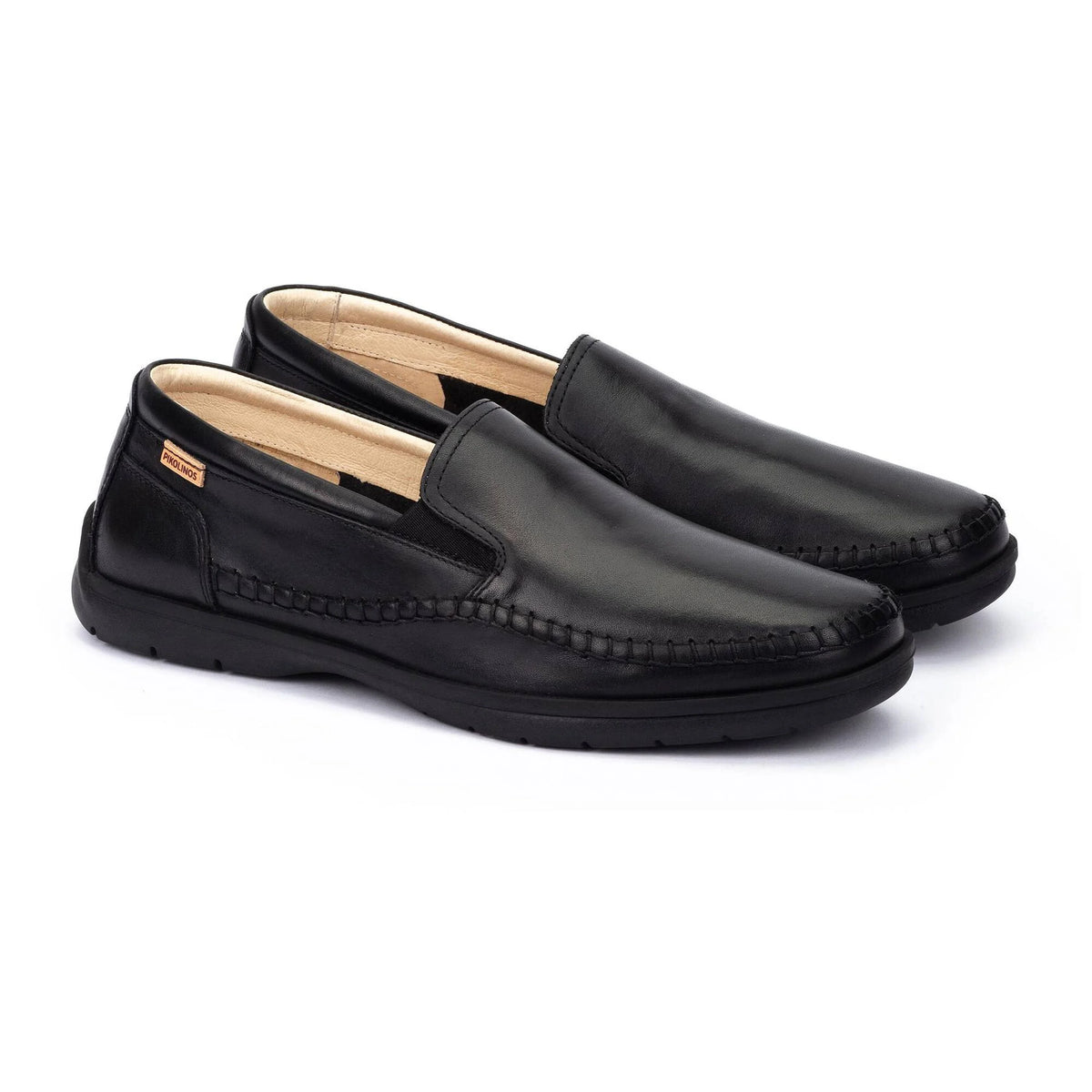 Pair of black loafers on a white background