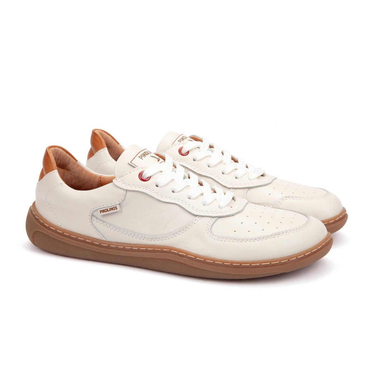 White sneakers with brown soles on a white background