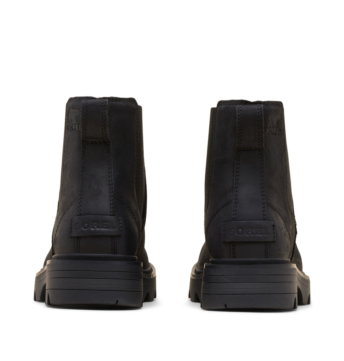 A pair of black ankle boots shown from the back, featuring a chunky sole and a pull tab with the brand name 'sorel
' embossed on the heel.