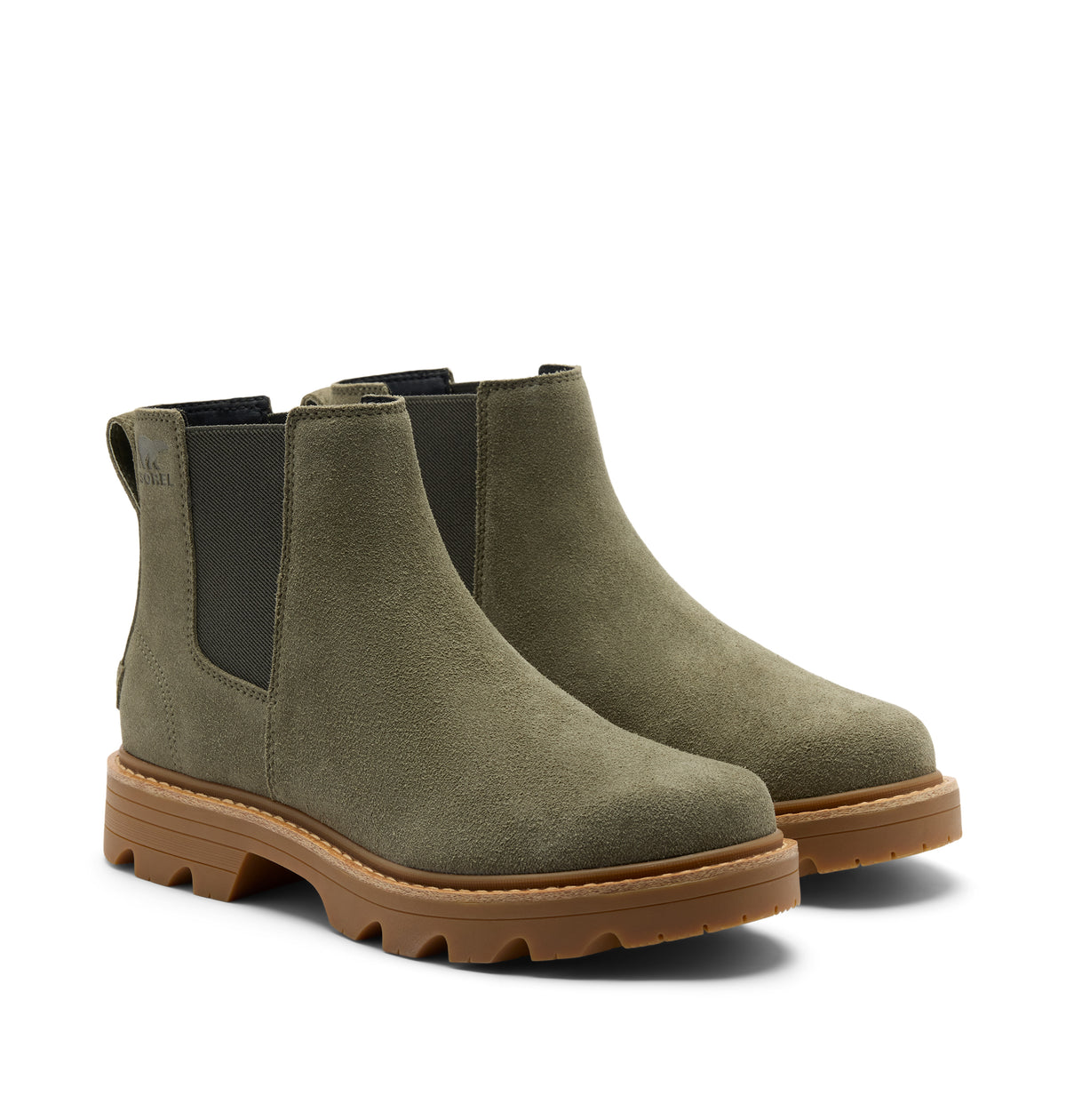 A pair of Chelsea-style ankle boots in olive green suede with black elastic side panels and chunky brown lug soles, photographed on a clean white background.