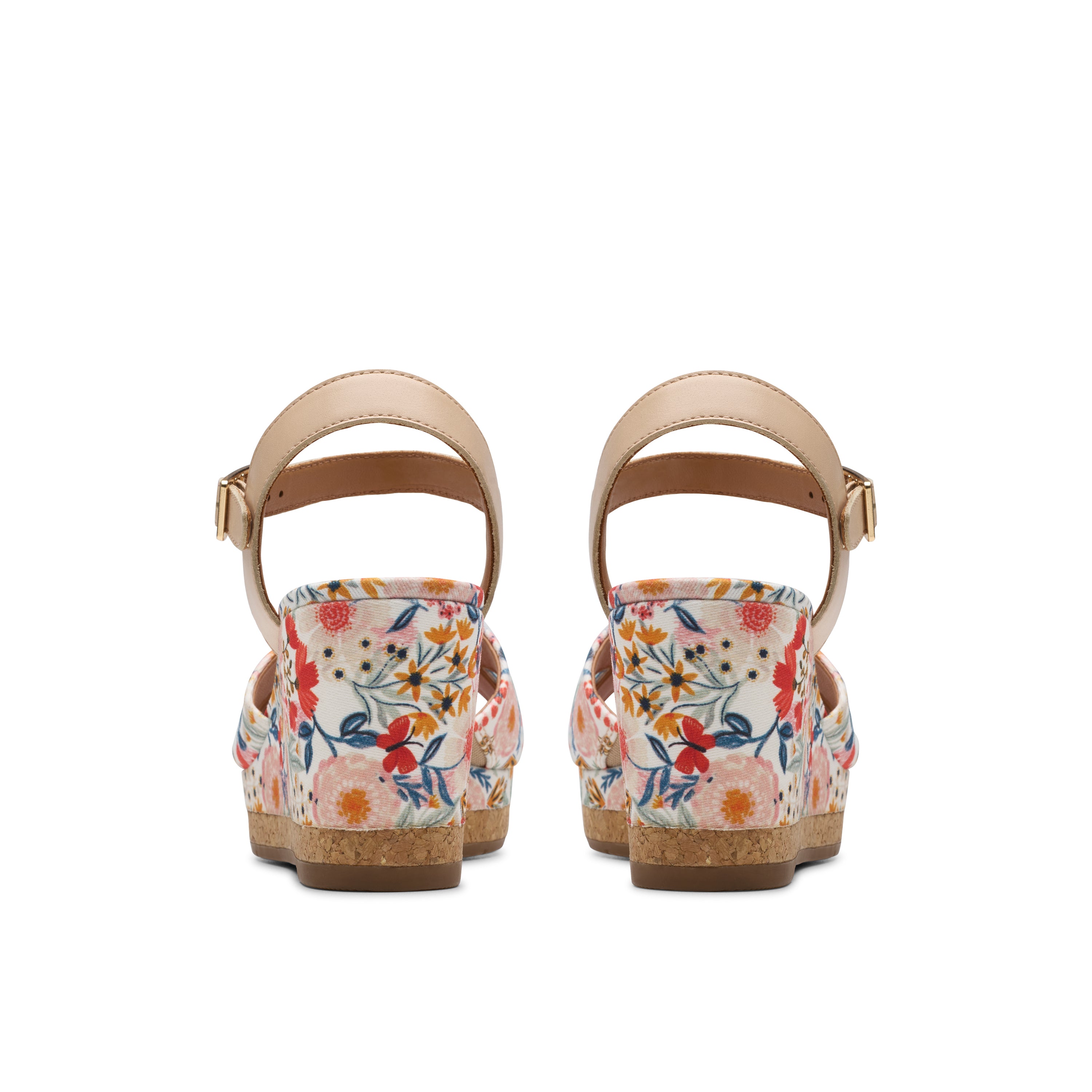 Pair of floral wedge sandals on a white background