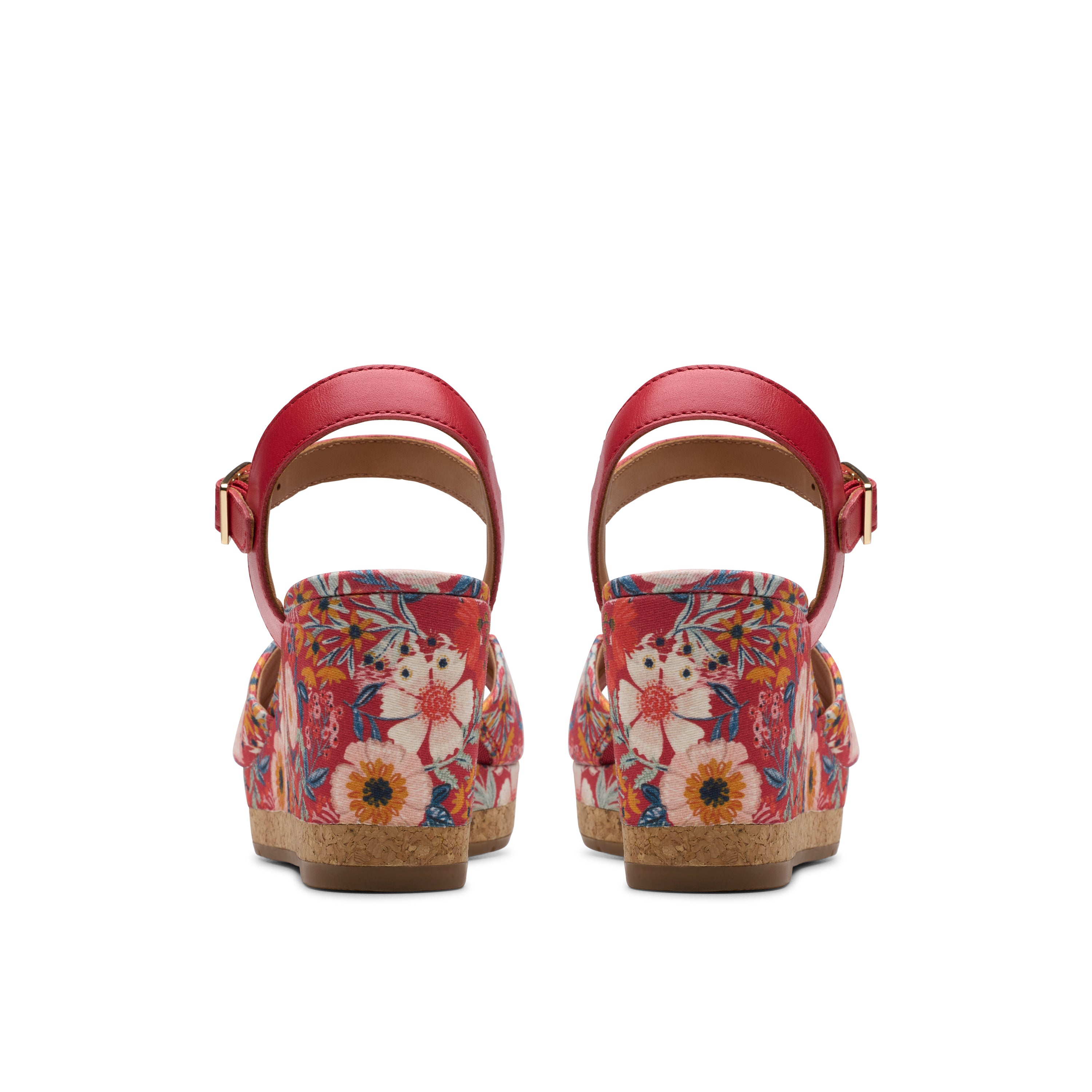 Pair of floral wedge sandals on a white background