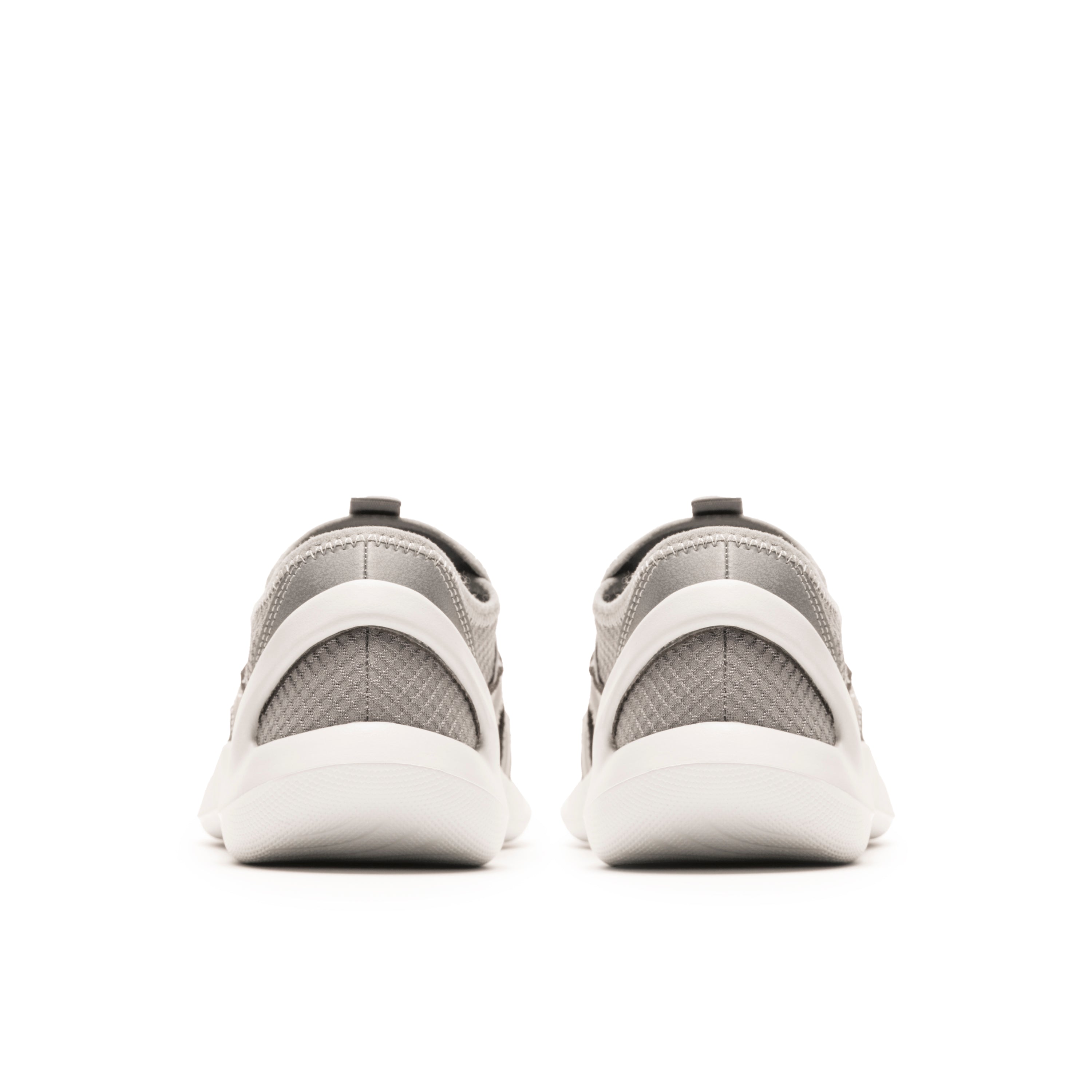 White athletic shoes with mesh design on a white background