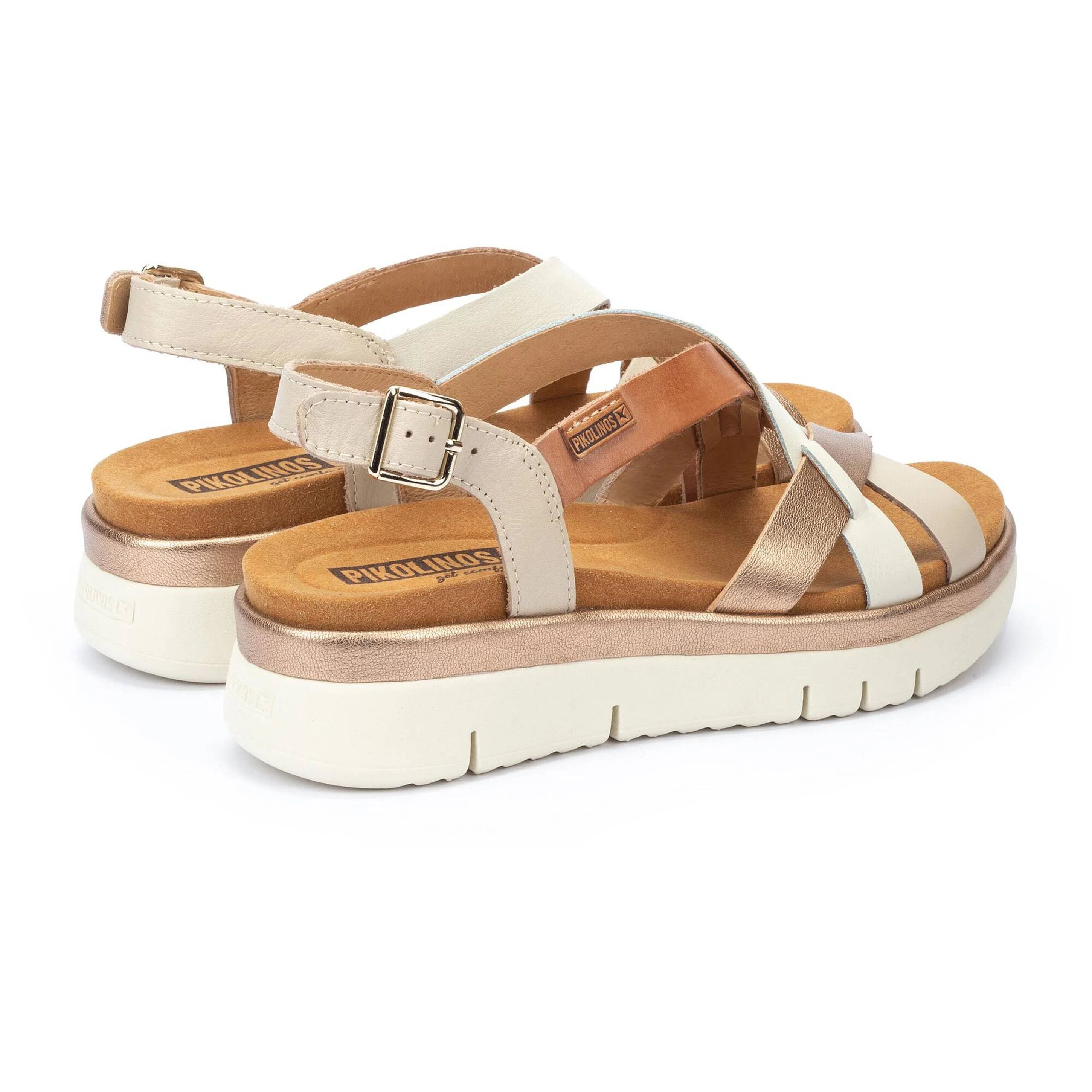 Pair of sandals with wooden sole on a white background