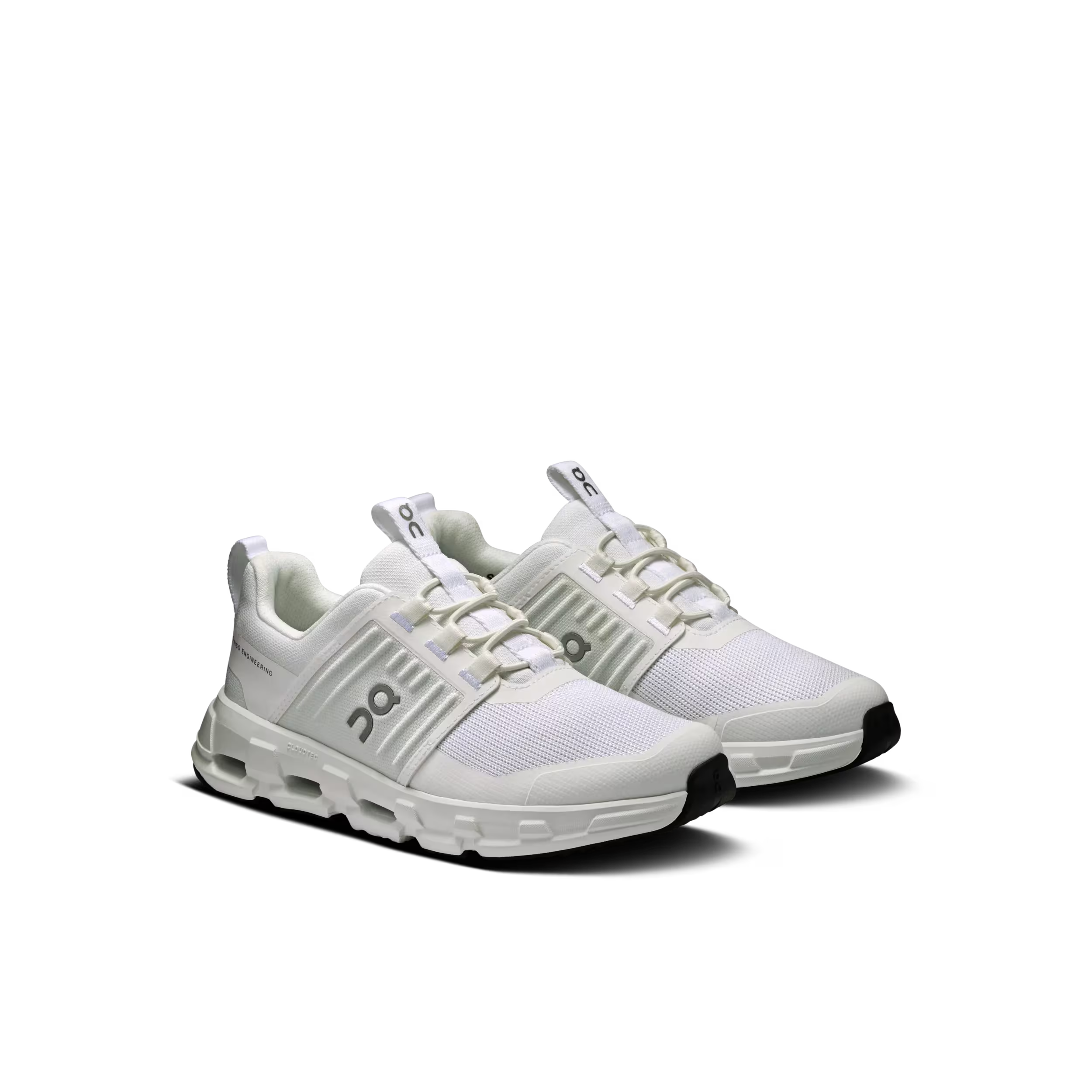 White sneakers with black soles on a white background