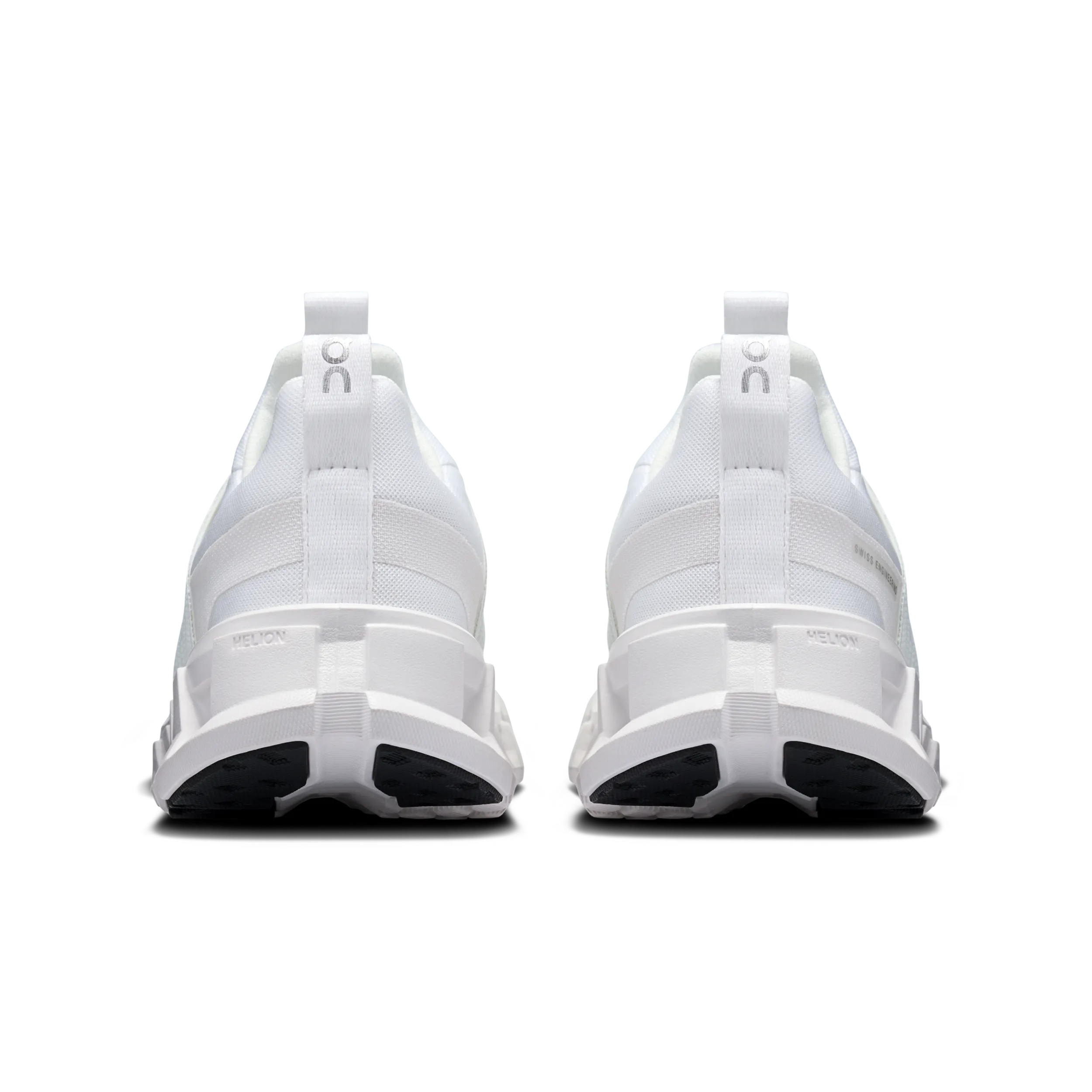White sneakers with black sole on a white background