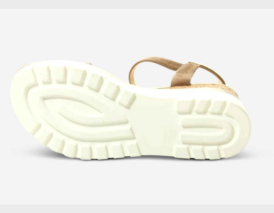 Sandal with a thick white sole on a light gray background