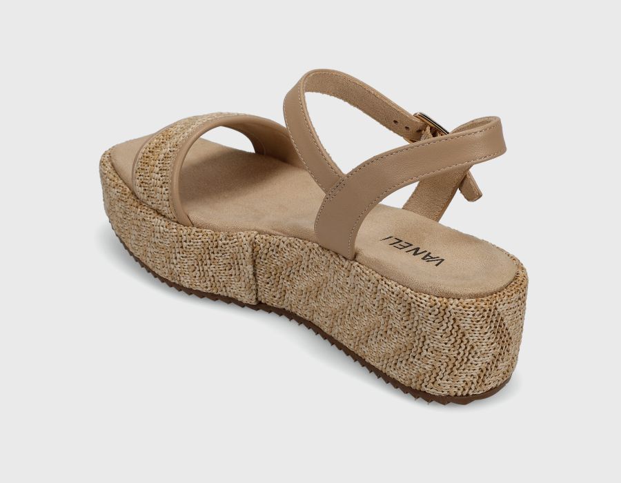 Beige sandal with woven sole on a light gray background