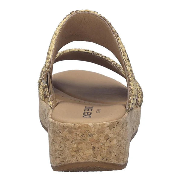 Gold wedge sandal with cork sole on a white background