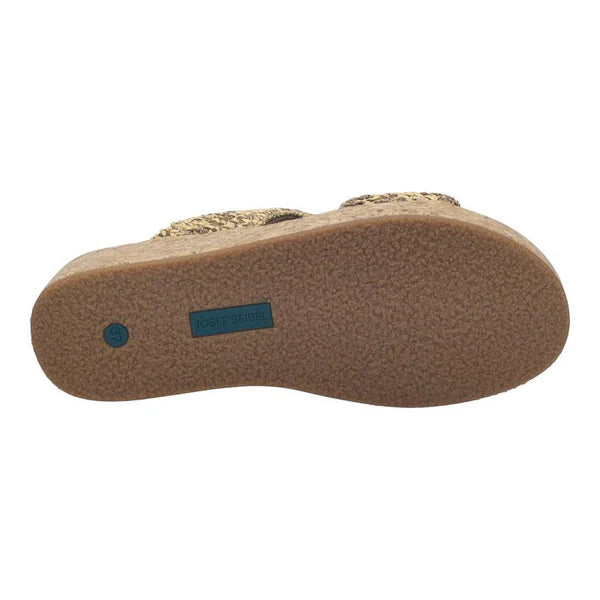 Close-up of a sandal sole with a brand logo on a white background