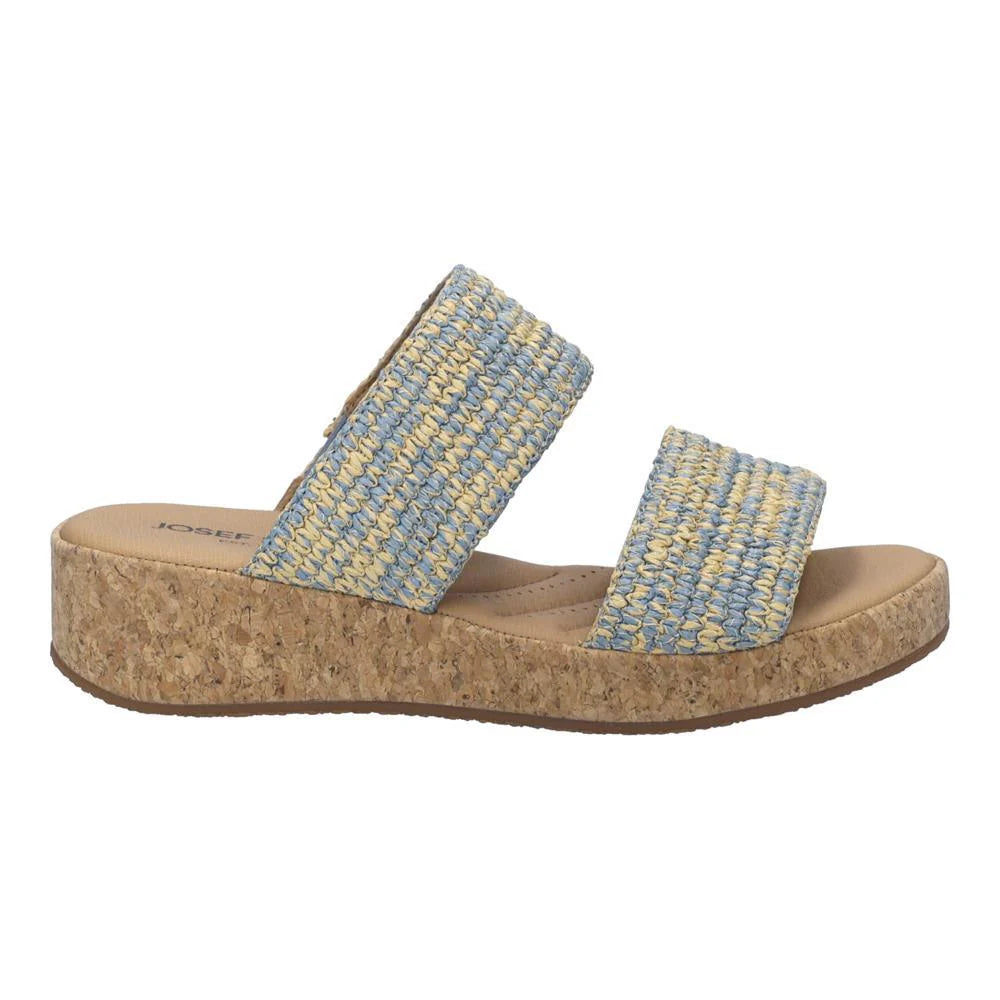 Blue and yellow woven sandal with cork sole on a white background