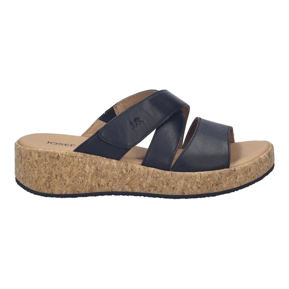 Black sandal with cork platform on a white background