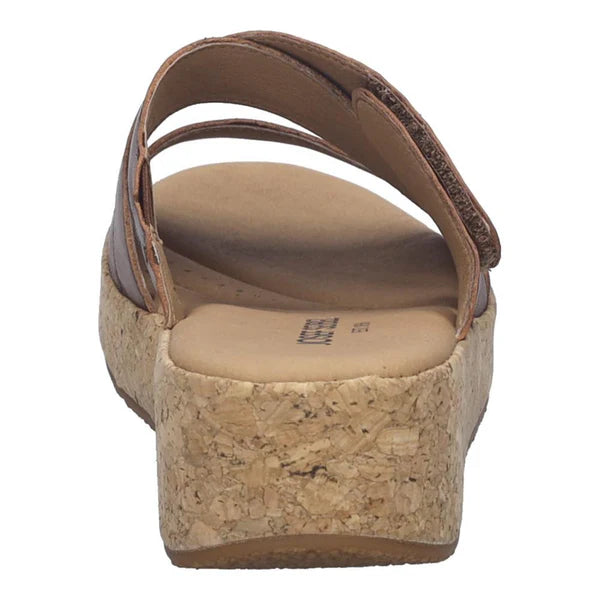 Brown sandal with cork wedge sole on a white background