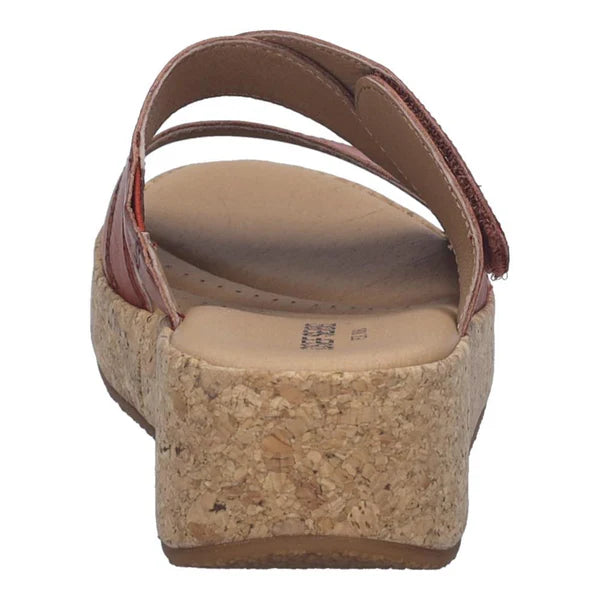 Wedge sandal with cork wedge sole on a white background