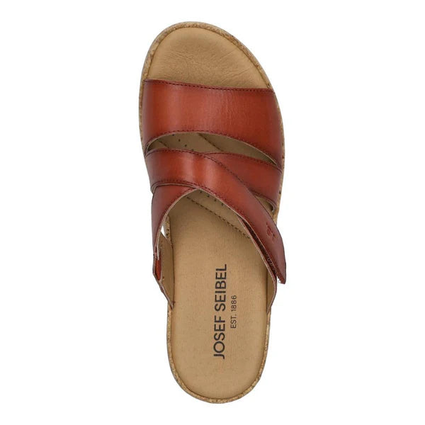 red sandal with tan insole on a white background