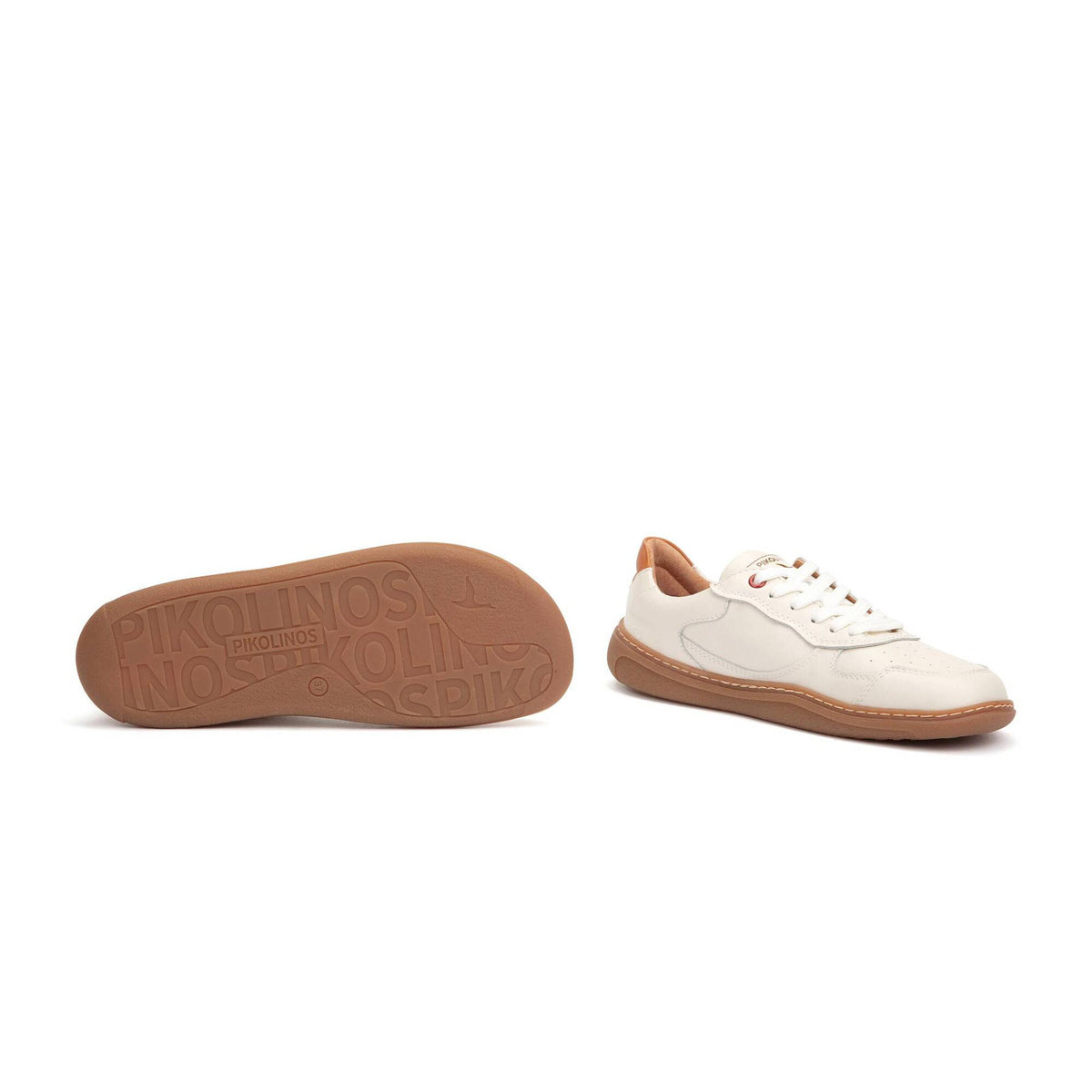 White sneaker with brown sole on a white background