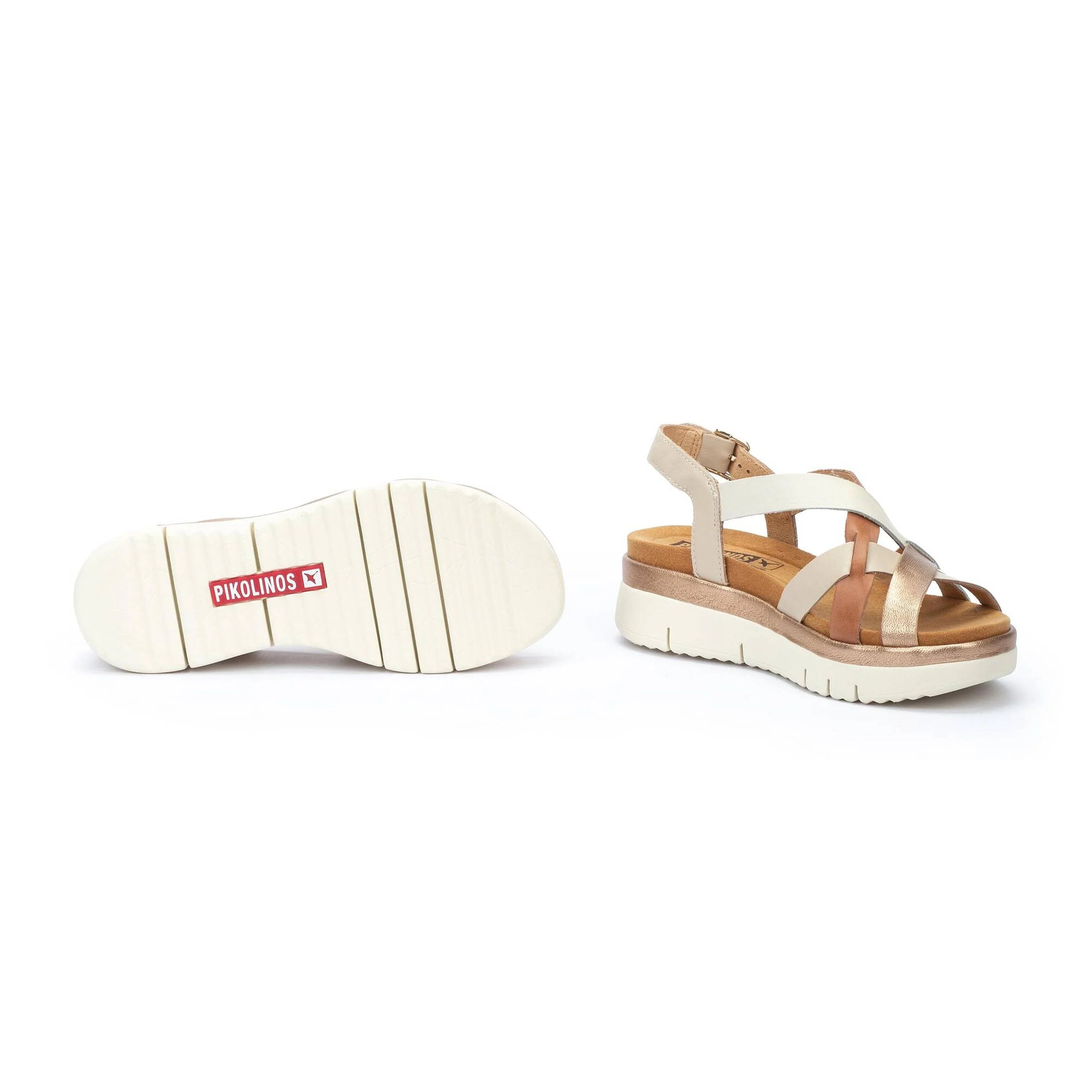 White sandal with beige sole on a white background