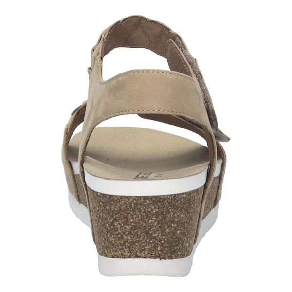 Beige sandal with cork wedge sole on a white background