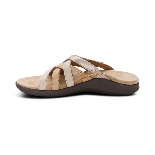 Beige sandal with brown sole on a white background
