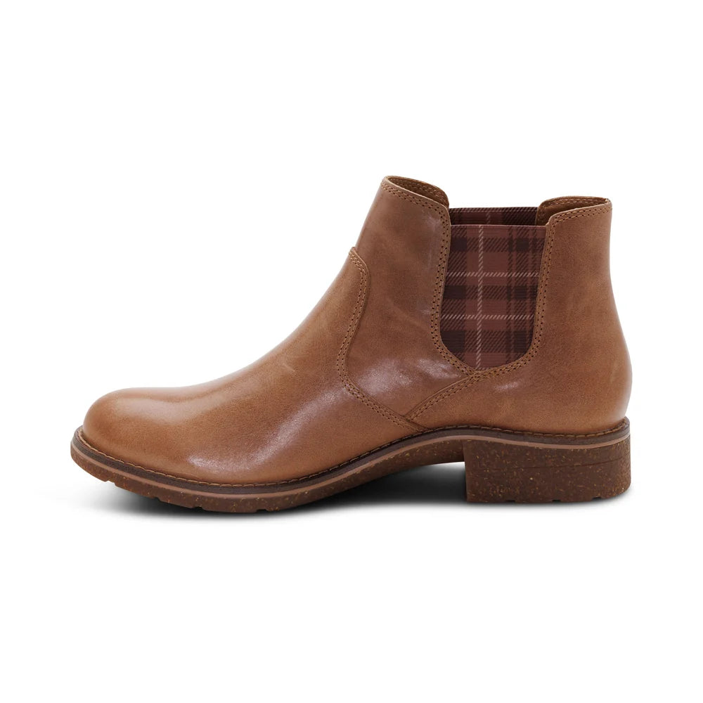Brown leather Chelsea boot on a white background