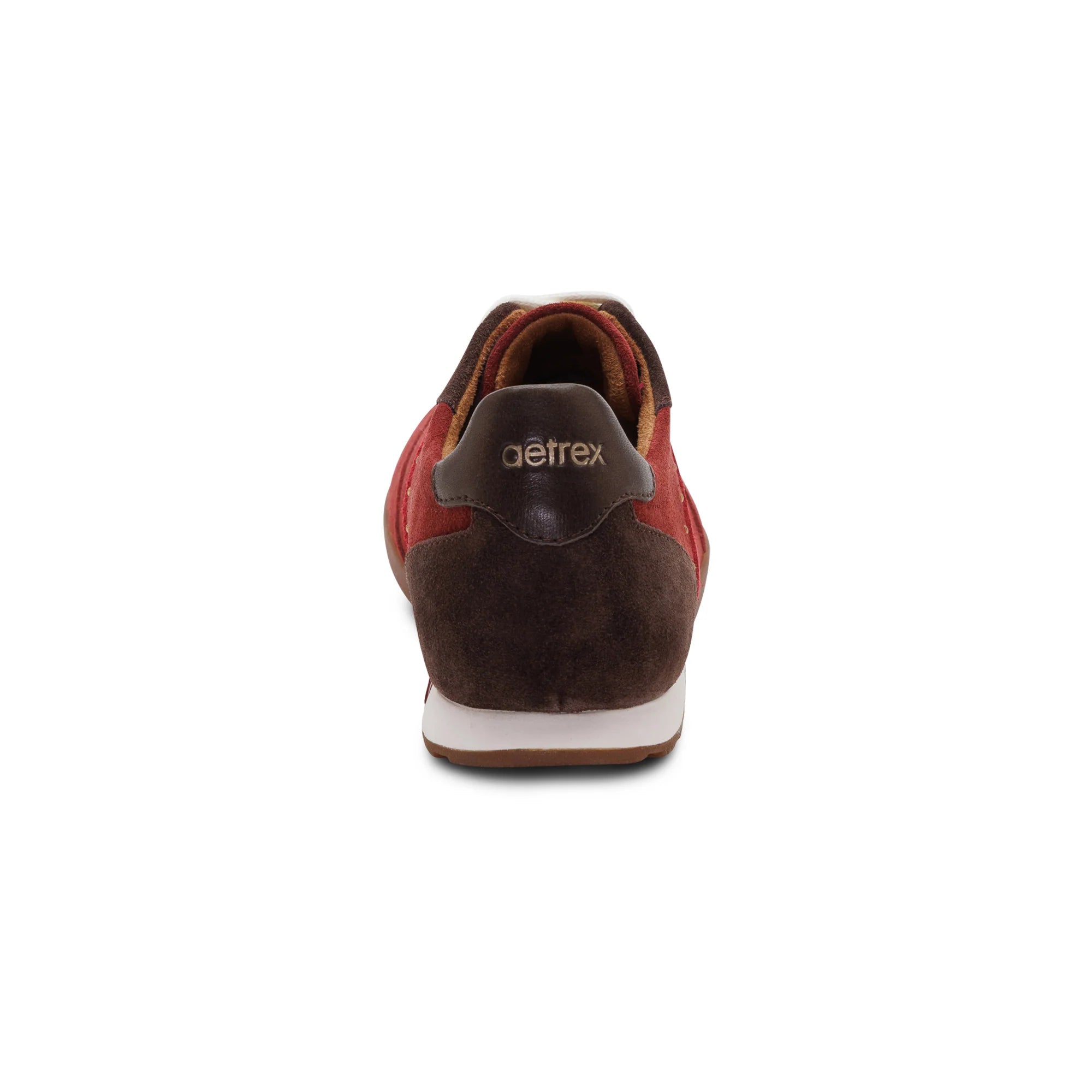 A single shoe shown from the back on a plain white background, featuring dark brown suede, red leather panels, a dark brown heel tab with the 'getrex' brand name in gold, and a white midsole.