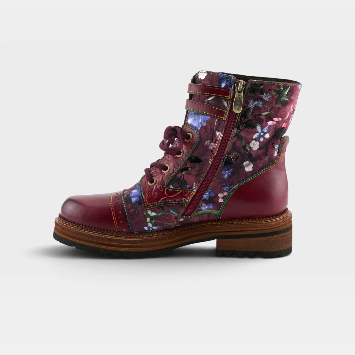 A single mid-calf lace-up boot with a burgundy leather toe and heel, a floral print side panel, and a side zipper, shown against a light gray background.