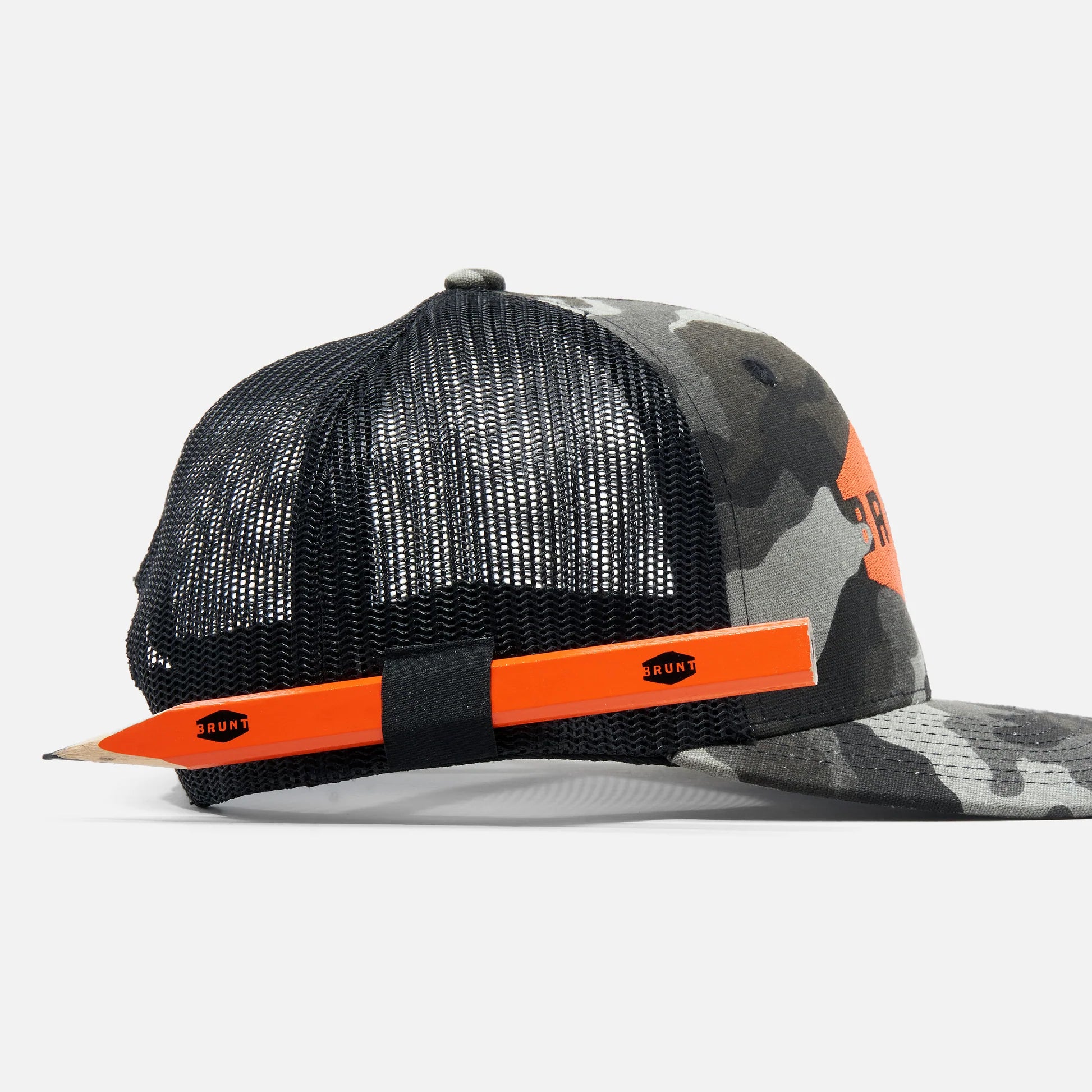 Camouflage cap with orange accents on a white background