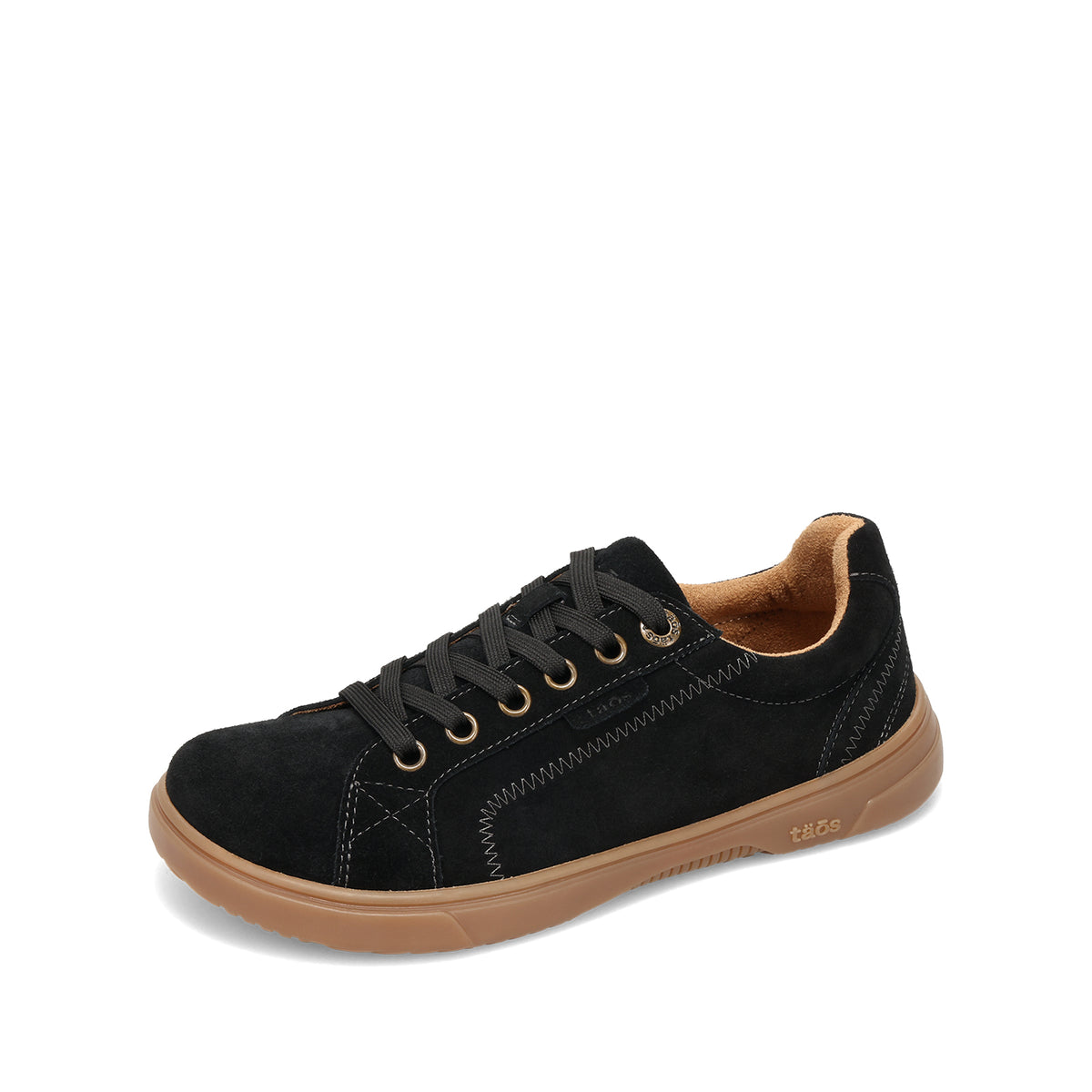 A black suede low-top sneaker with black laces, gold eyelets, and a tan rubber sole, shown from a three-quarters angle on a white background.