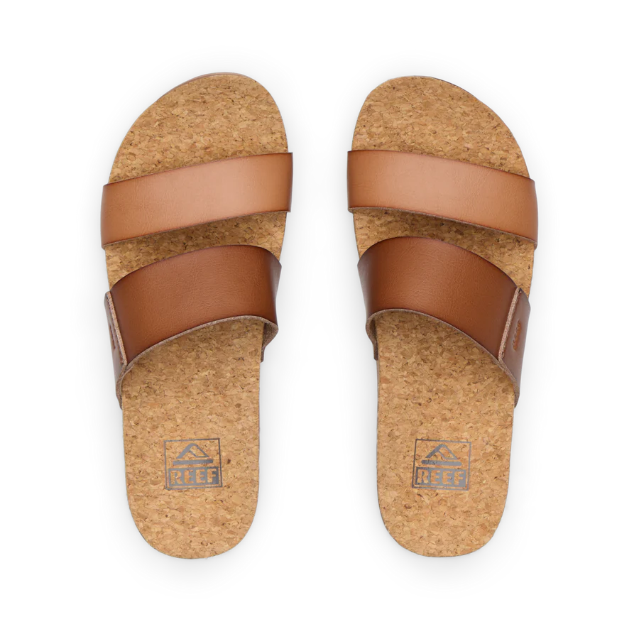 Pair of brown cork sandals on a white background