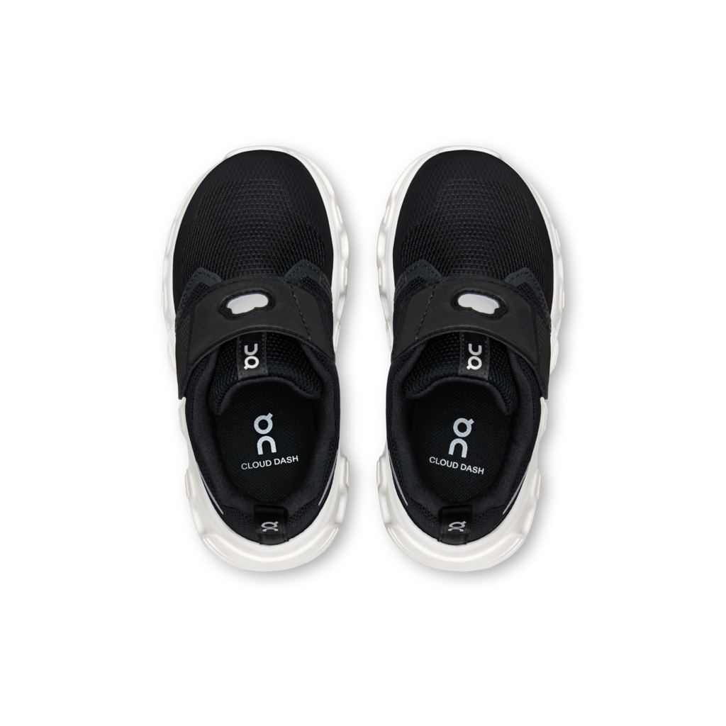 A pair of black On Cloud Dash slip-on sneakers shown from a top-down view on a clean white background.