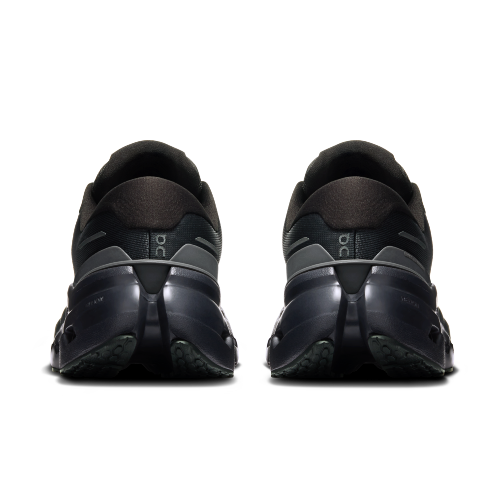 Black athletic shoes with visible brand logo on a white background