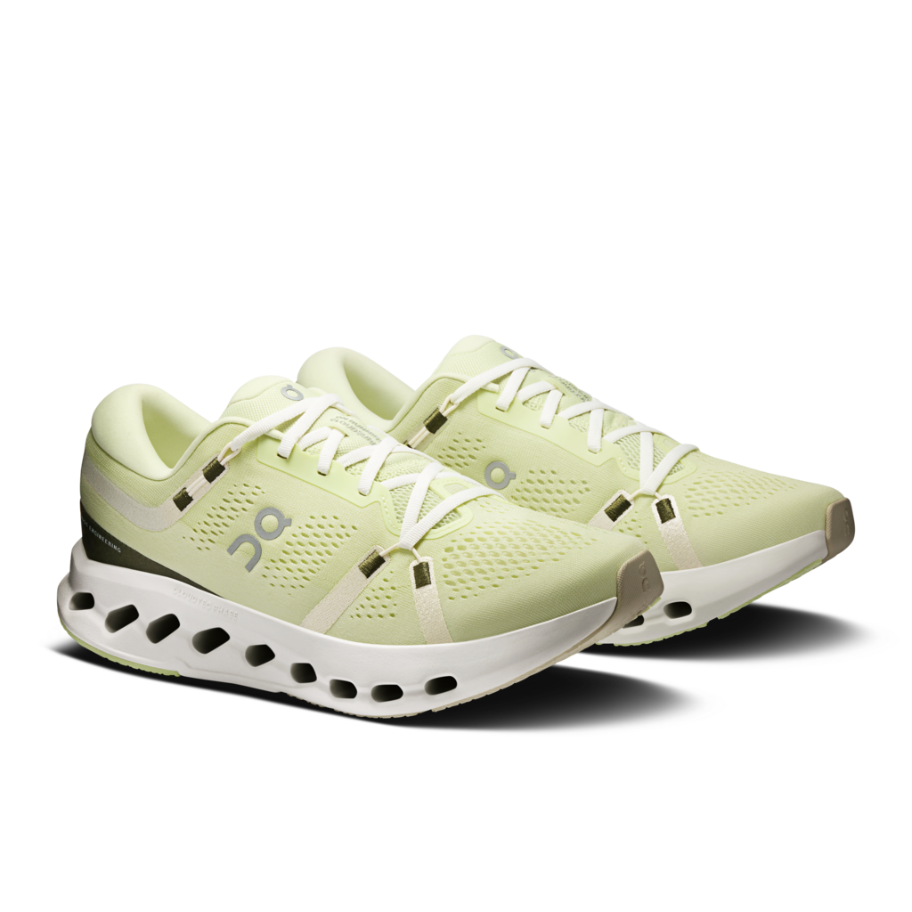 Light green running shoes with white soles on a transparent background
