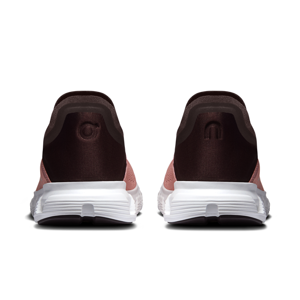A pair of on sneakers shown from the back, featuring a dark brown knit upper, a dusty pink heel accent, and a thick white midsole.