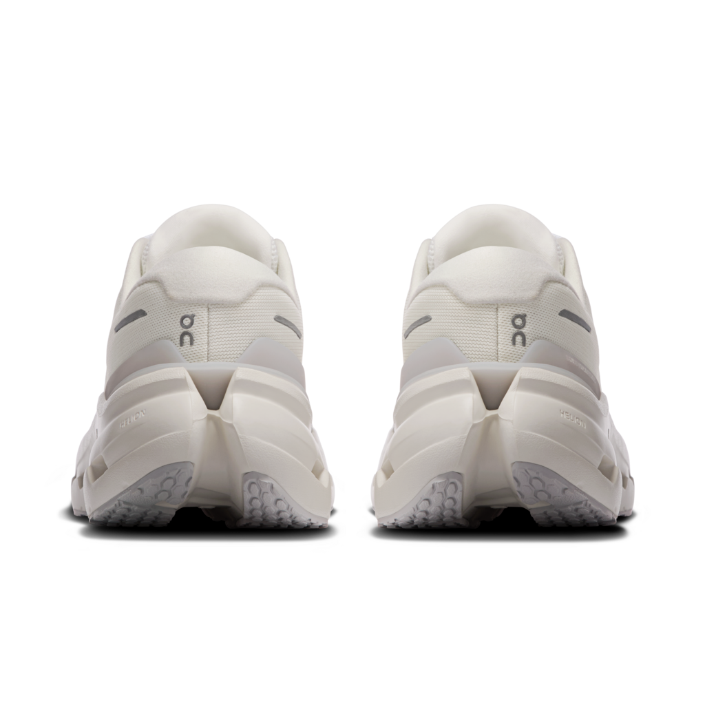 White athletic shoes shown from the back on a white background