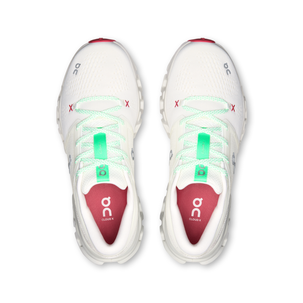 A pair of On Cloud running shoes shown from a top-down view, featuring a white mesh upper with mint green laces, red accents on the toe and heel, and a red interior lining with the On logo.