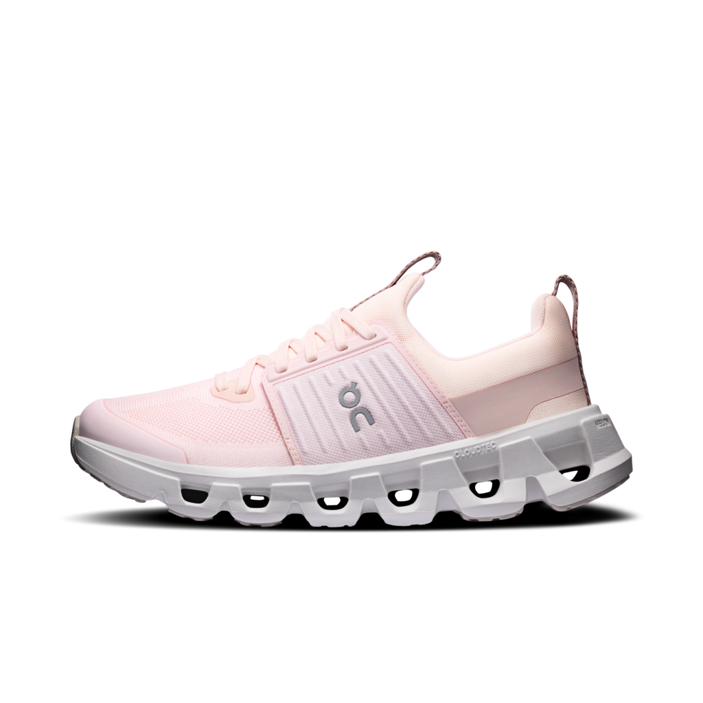 Pink running shoe with white sole on a white background