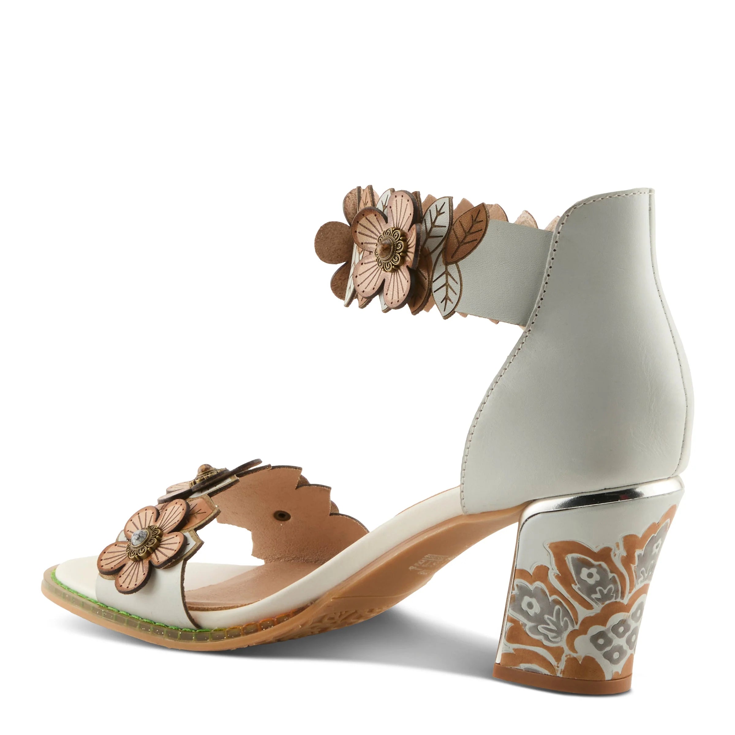 White sandal with floral design on a white background