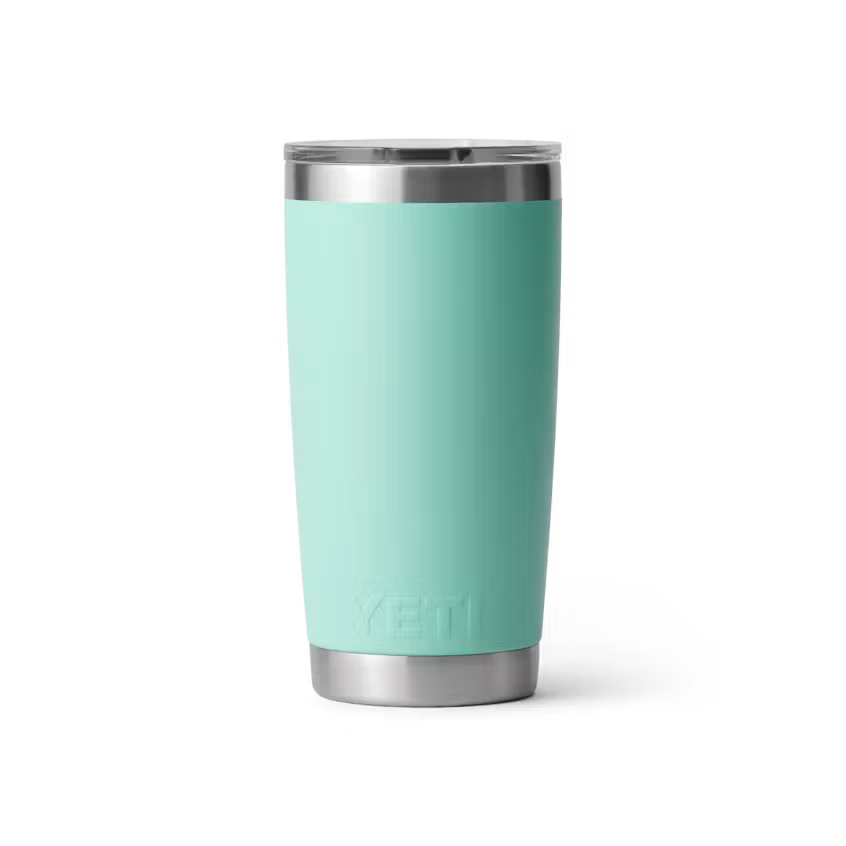 Turquoise YETI tumbler with a silver rim on a white background