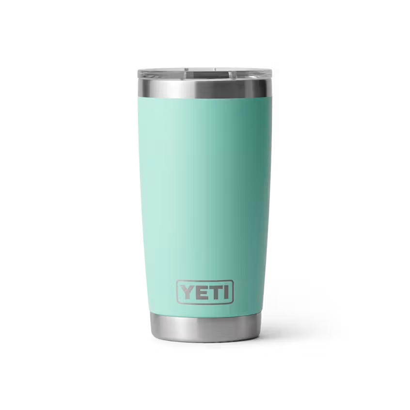 Turquoise YETI tumbler with silver lid on a white background
