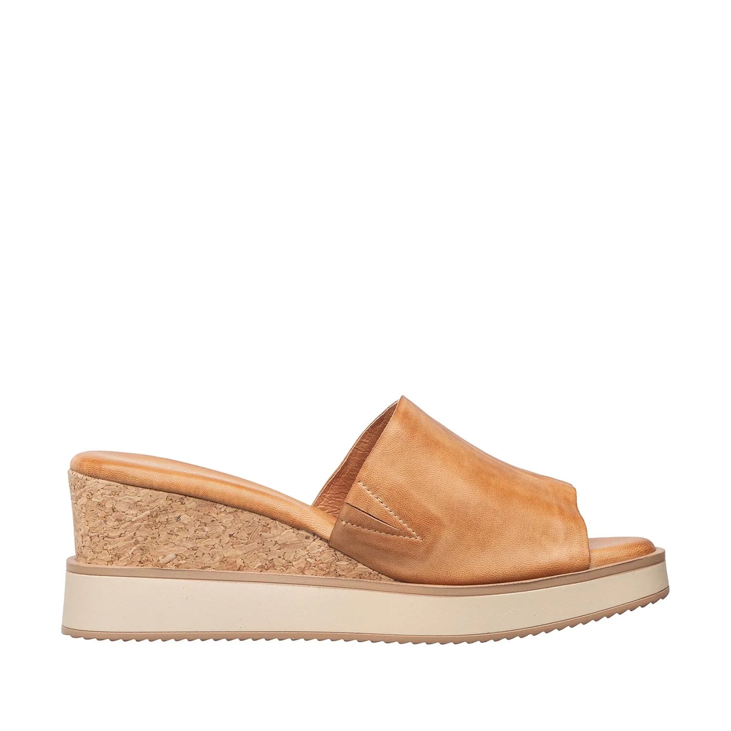 Tan sandal with cork wedge sole on a white background