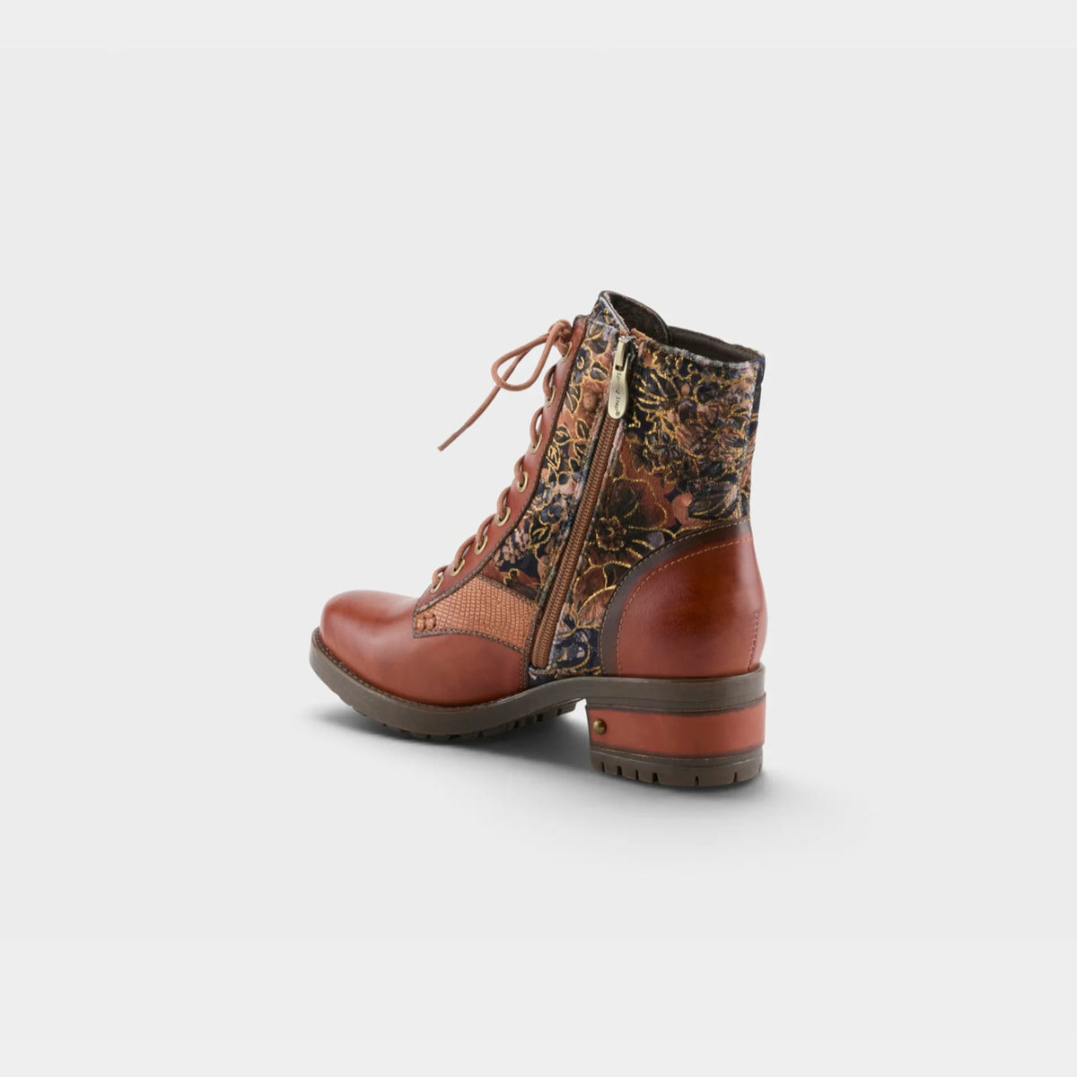 A single ankle boot shown from the side on a light gray background. The boot features smooth brown leather panels, a floral-patterned fabric upper, brown laces, and a chunky brown block heel.