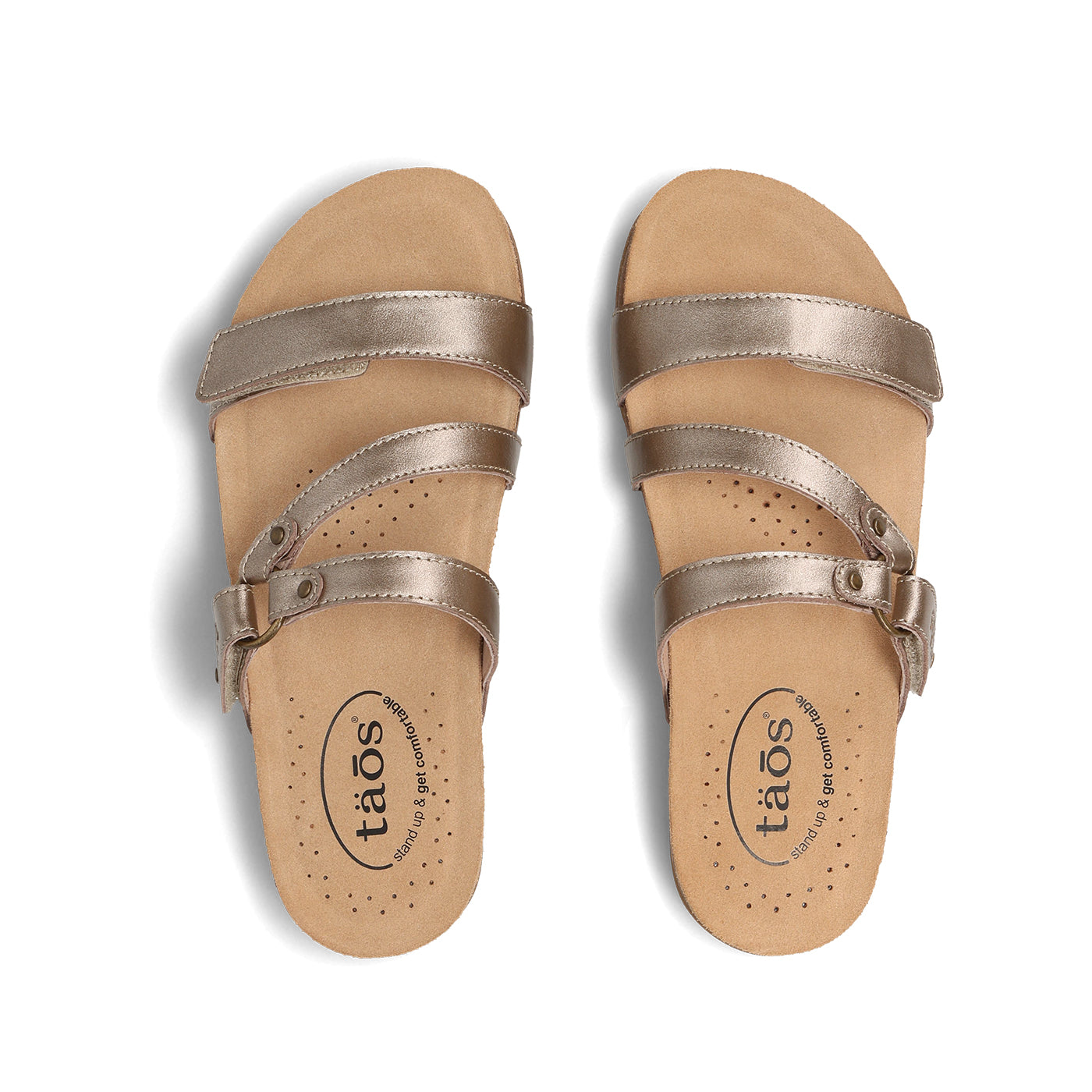 Pair of metallic sandals with 'taos' branding on a white background