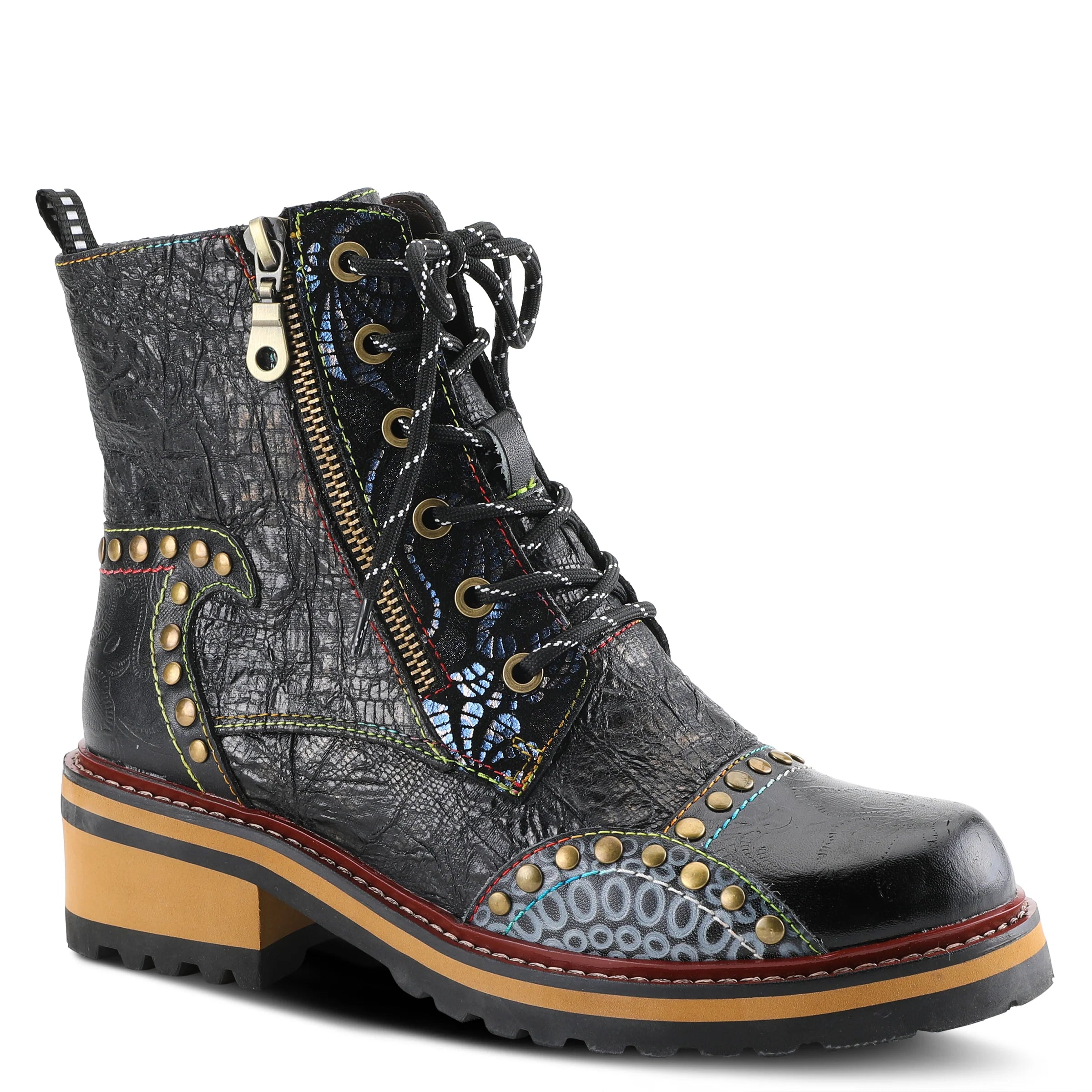 Black leather boot with decorative patterns and gold studs on a white background