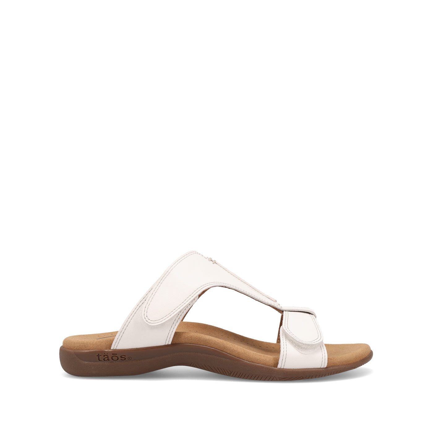 White sandal with brown sole on a white background
