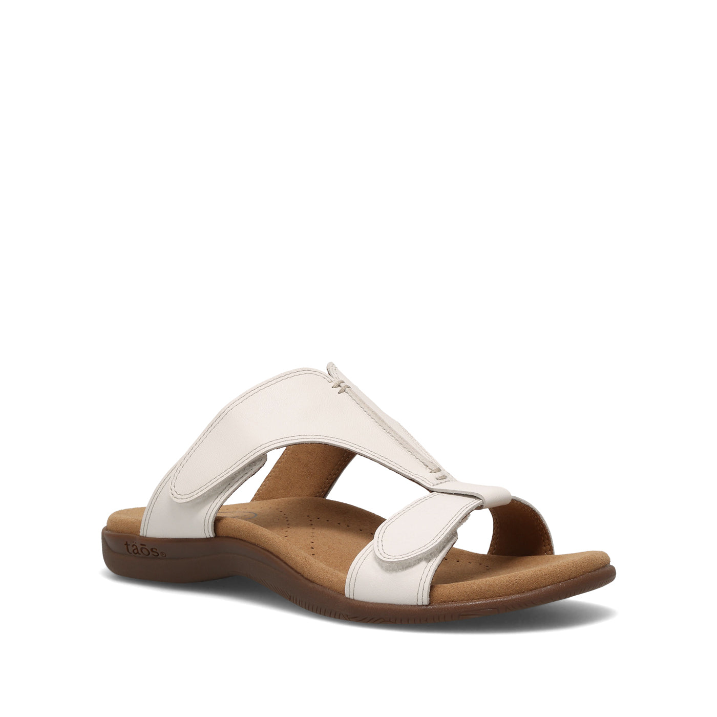 White sandal with brown sole on a white background