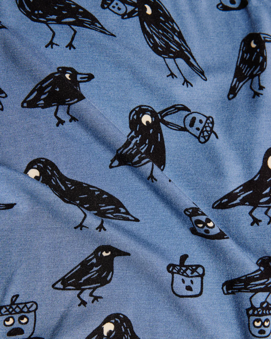 Blue fabric with black bird illustrations