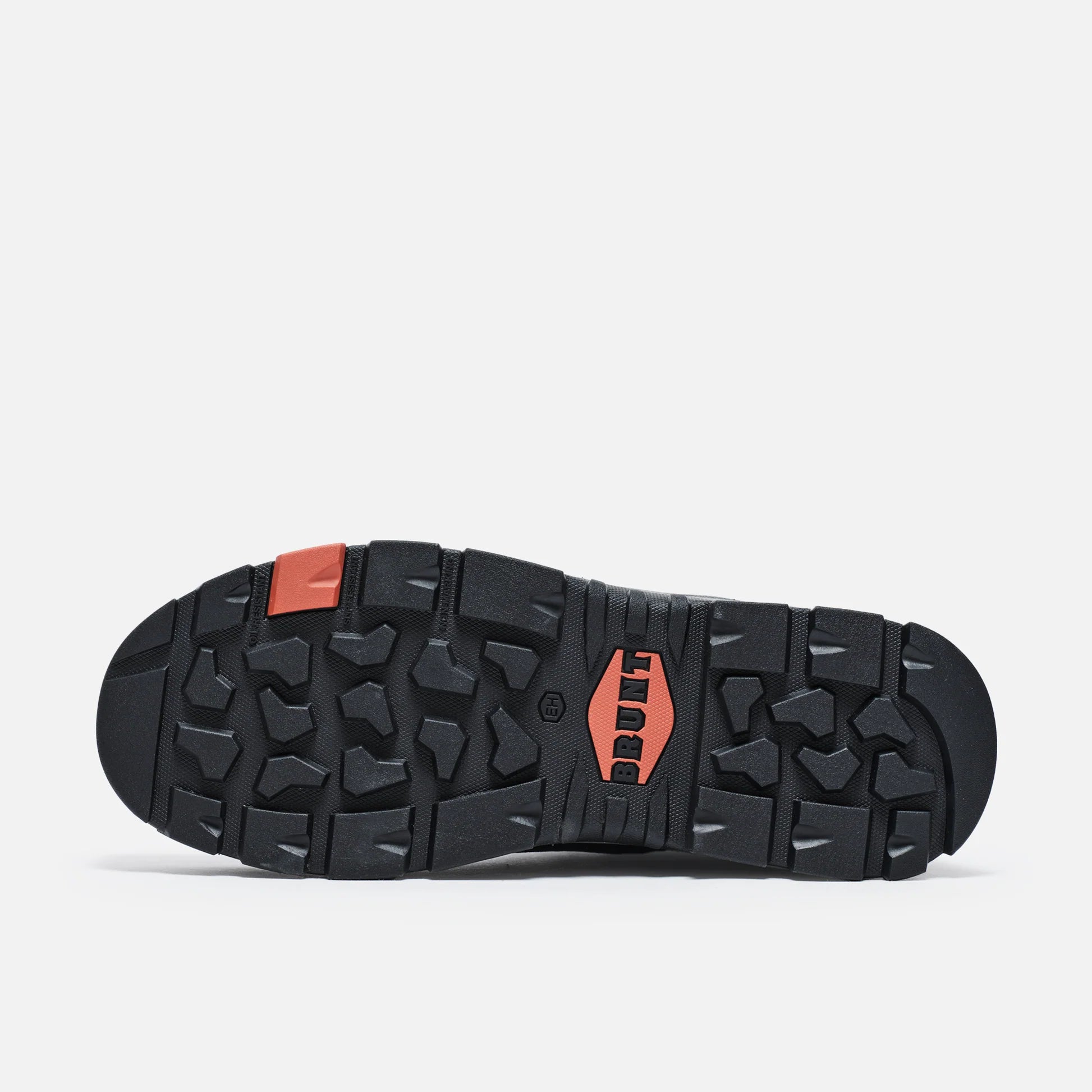 Black and orange sole of a shoe on a white background