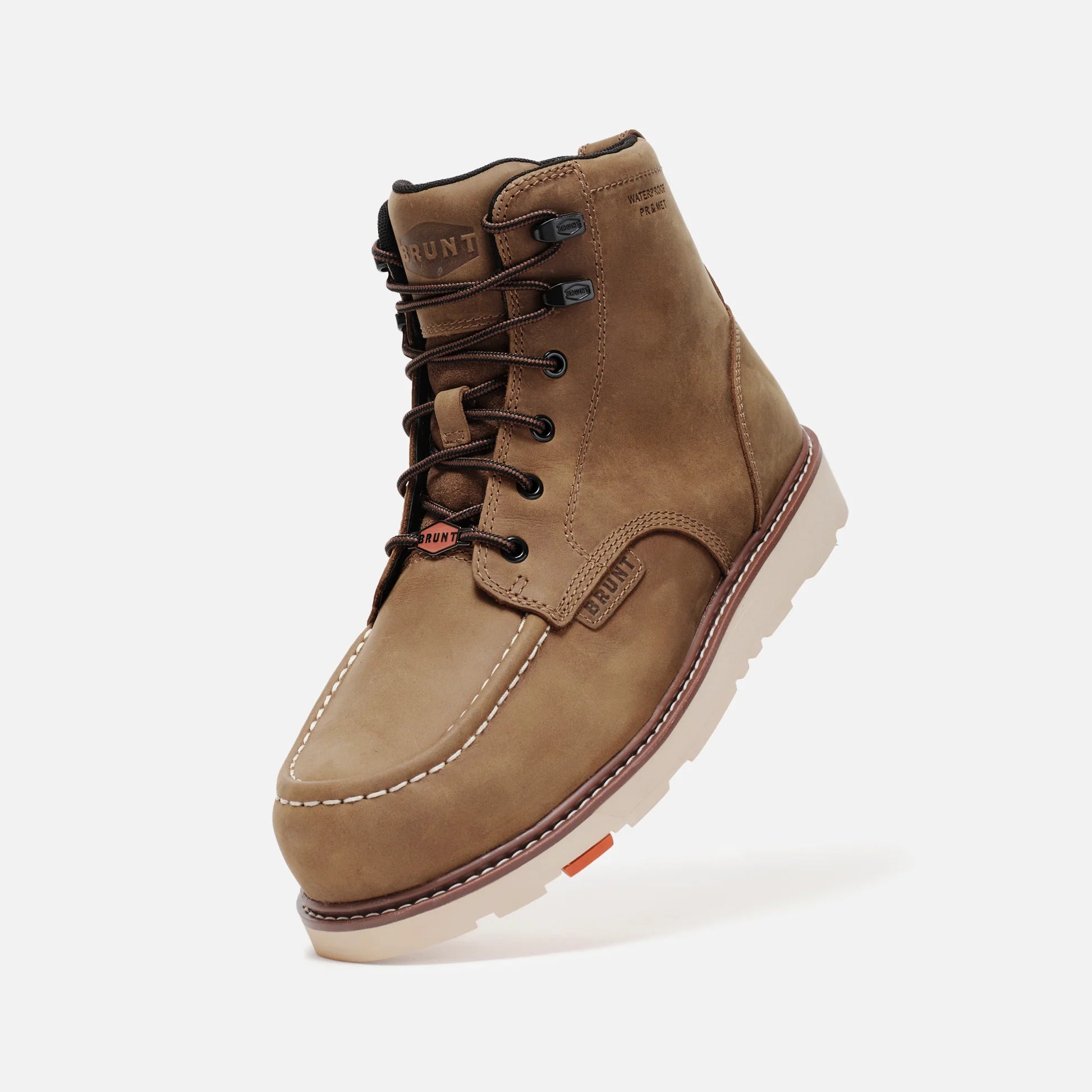 Brown leather boot with white sole on a light gray background